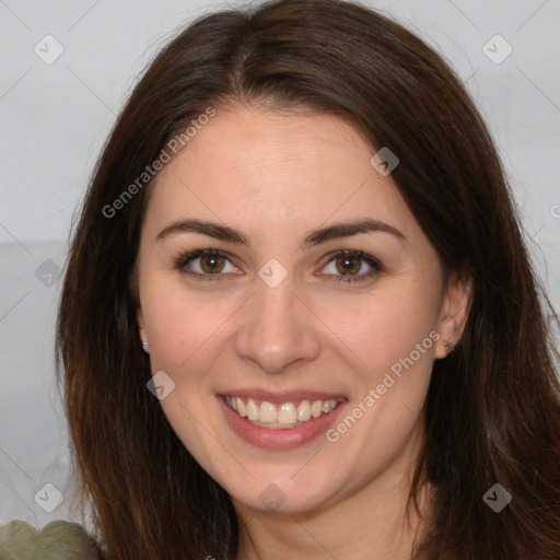 Joyful white adult female with long  brown hair and brown eyes