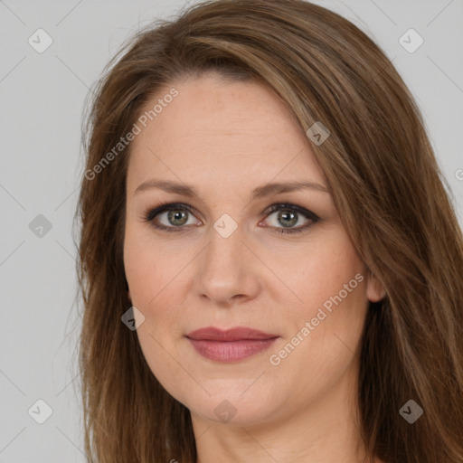 Joyful white adult female with long  brown hair and brown eyes