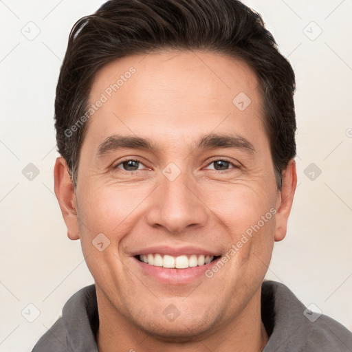 Joyful white young-adult male with short  brown hair and brown eyes