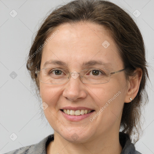 Joyful white adult female with medium  brown hair and grey eyes