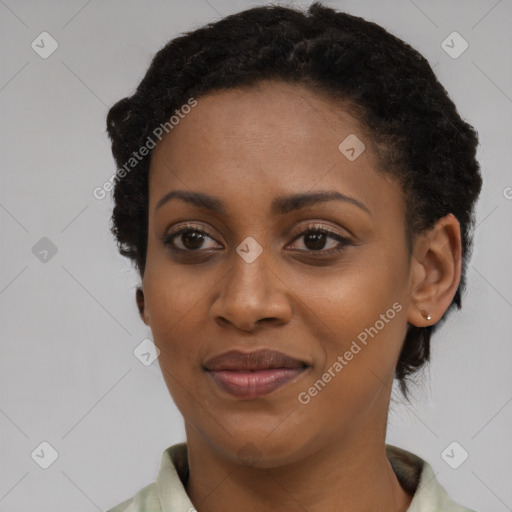 Joyful black young-adult female with short  black hair and brown eyes