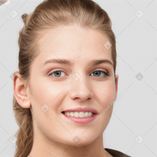 Joyful white young-adult female with long  brown hair and blue eyes