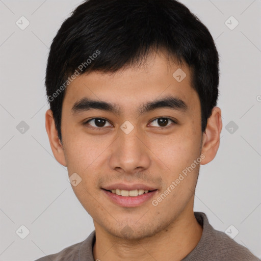 Joyful asian young-adult male with short  black hair and brown eyes