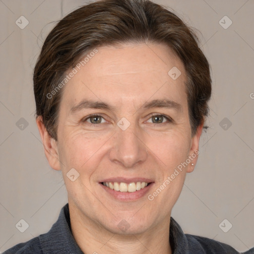 Joyful white adult male with short  brown hair and grey eyes