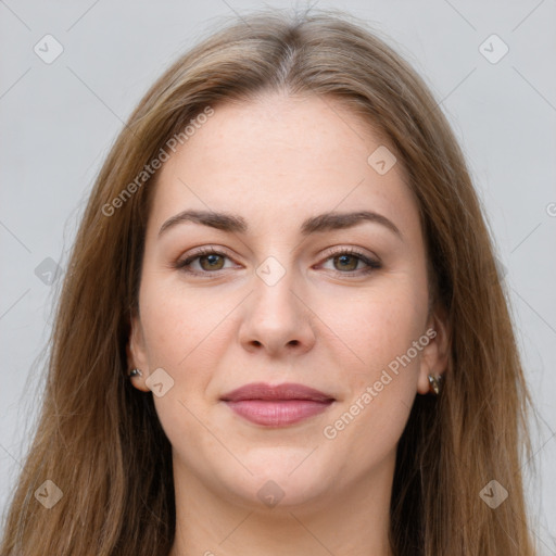 Joyful white young-adult female with long  brown hair and brown eyes