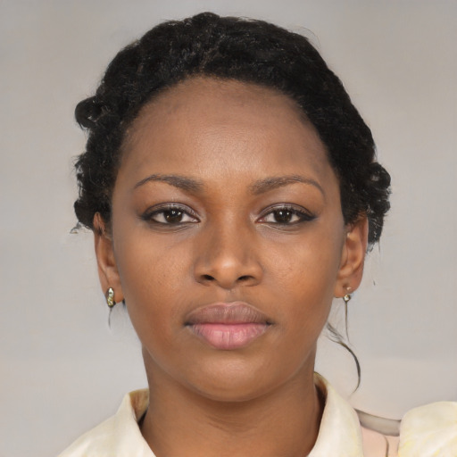 Neutral black young-adult female with medium  black hair and brown eyes