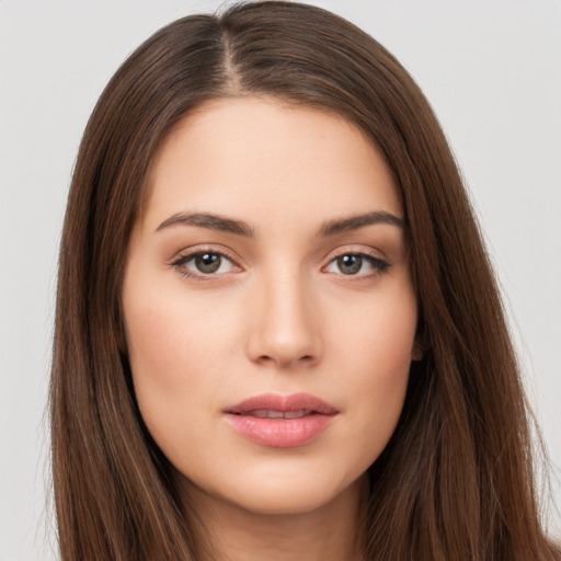 Neutral white young-adult female with long  brown hair and brown eyes