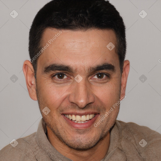 Joyful white adult male with short  brown hair and brown eyes