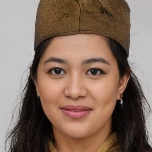 Joyful asian young-adult female with long  brown hair and brown eyes
