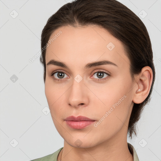 Neutral white young-adult female with medium  brown hair and brown eyes