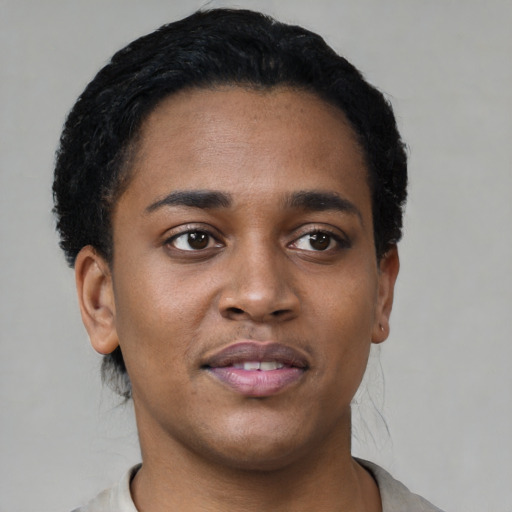 Joyful black young-adult female with short  black hair and brown eyes