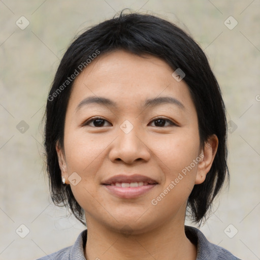 Joyful asian young-adult female with medium  black hair and brown eyes