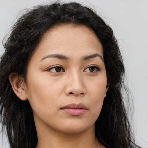 Neutral latino young-adult female with long  brown hair and brown eyes
