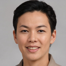 Joyful asian young-adult male with short  black hair and brown eyes