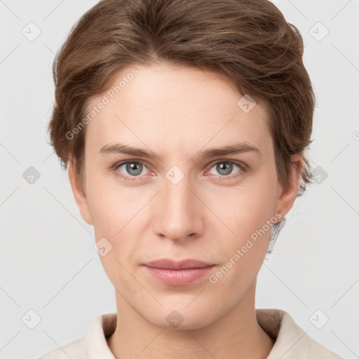 Joyful white young-adult female with short  brown hair and grey eyes