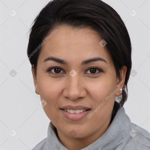 Joyful latino young-adult female with medium  brown hair and brown eyes