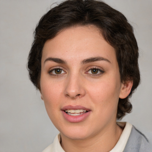 Joyful white young-adult female with medium  brown hair and green eyes