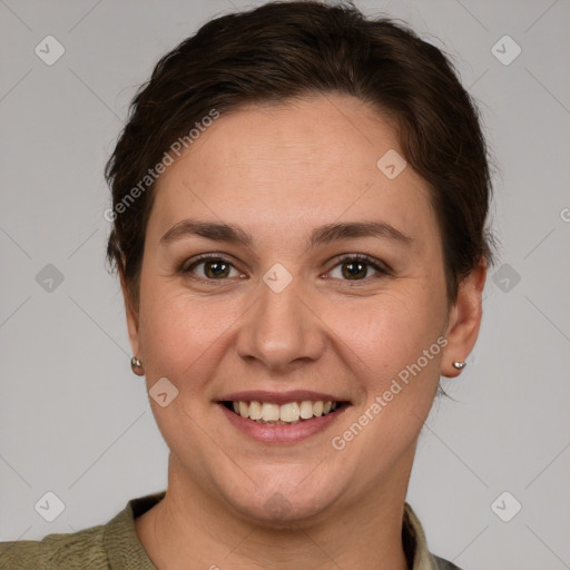 Joyful white young-adult female with short  brown hair and grey eyes