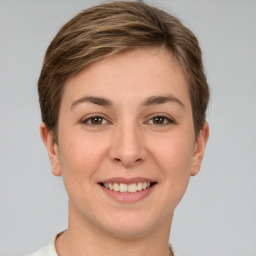 Joyful white young-adult female with short  brown hair and brown eyes