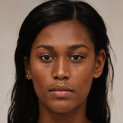 Neutral black young-adult female with long  black hair and brown eyes
