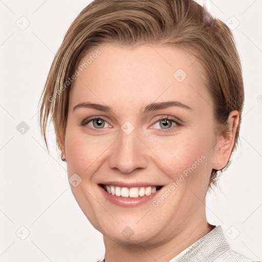 Joyful white young-adult female with medium  brown hair and grey eyes