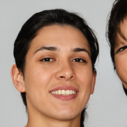 Joyful white young-adult female with medium  brown hair and brown eyes