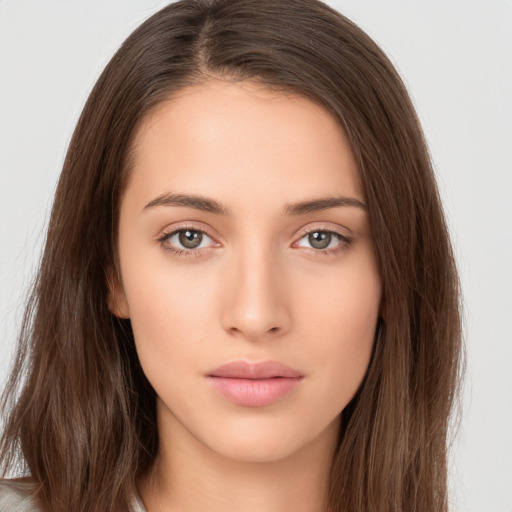 Neutral white young-adult female with long  brown hair and brown eyes