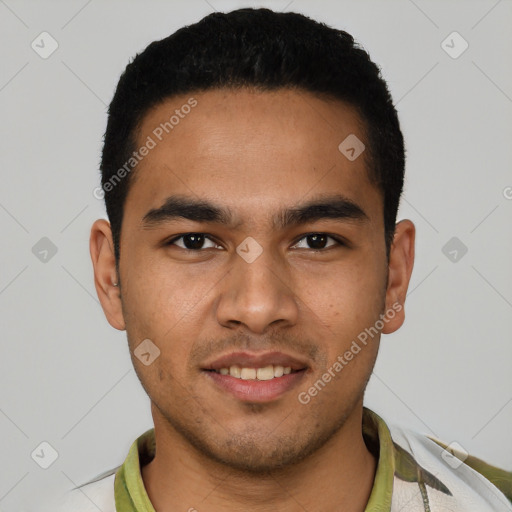 Joyful white young-adult male with short  black hair and brown eyes