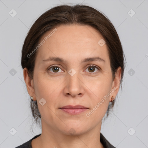 Joyful white adult female with medium  brown hair and brown eyes