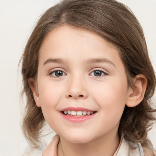 Joyful white child female with medium  brown hair and grey eyes