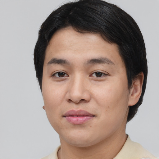 Joyful asian young-adult male with short  brown hair and brown eyes