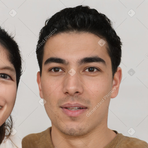 Neutral white young-adult male with short  black hair and brown eyes