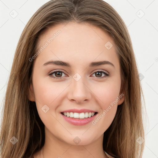 Joyful white young-adult female with long  brown hair and green eyes