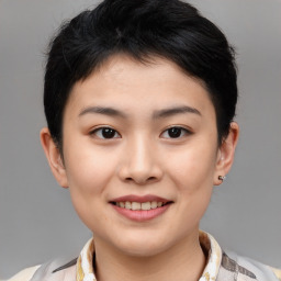 Joyful asian young-adult female with short  brown hair and brown eyes