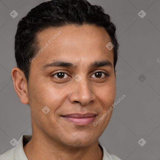 Joyful latino young-adult male with short  brown hair and brown eyes