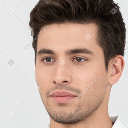 Neutral white young-adult male with short  brown hair and brown eyes