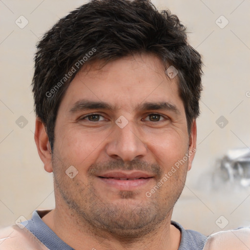 Joyful white adult male with short  brown hair and brown eyes