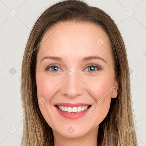 Joyful white young-adult female with long  brown hair and grey eyes