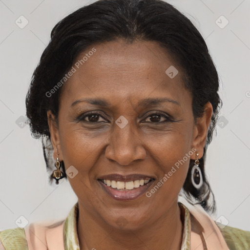 Joyful latino adult female with medium  brown hair and brown eyes