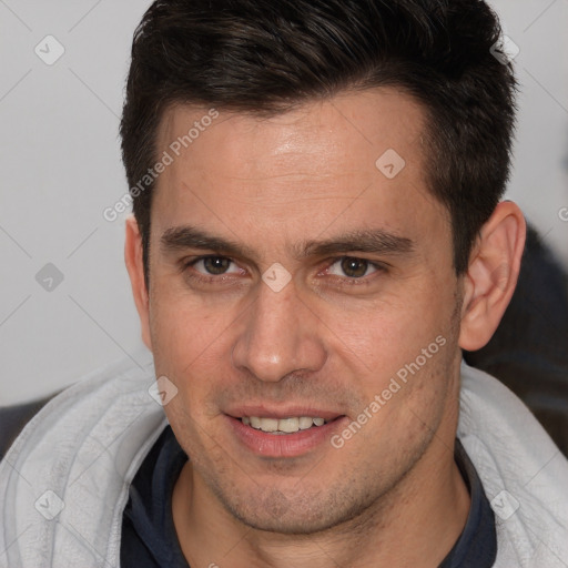 Joyful white young-adult male with short  brown hair and brown eyes