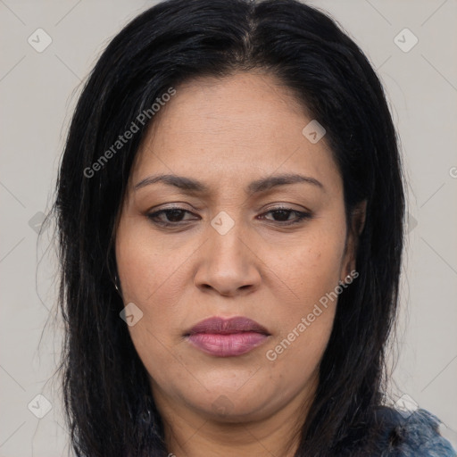 Joyful latino adult female with long  brown hair and brown eyes