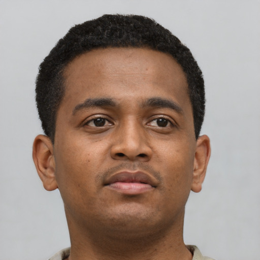 Neutral black young-adult male with short  brown hair and brown eyes