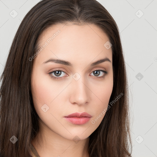 Neutral white young-adult female with long  brown hair and brown eyes