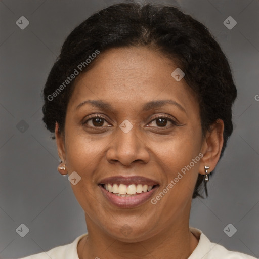 Joyful latino adult female with short  brown hair and brown eyes