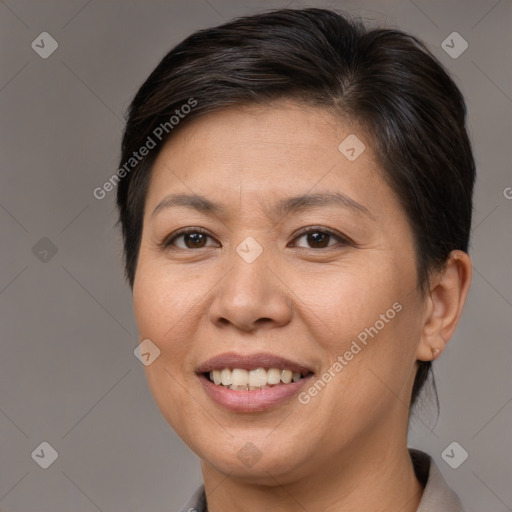 Joyful white adult female with short  brown hair and brown eyes