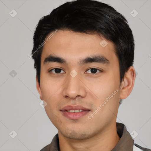 Joyful asian young-adult male with short  black hair and brown eyes