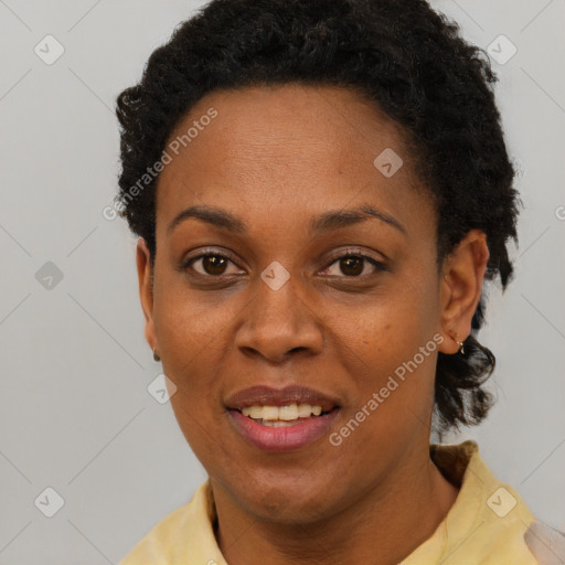 Joyful black young-adult female with short  brown hair and brown eyes