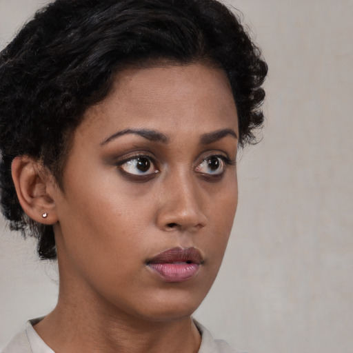 Neutral black young-adult female with short  brown hair and brown eyes