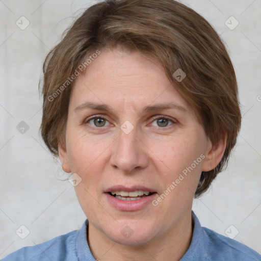 Joyful white adult female with medium  brown hair and blue eyes