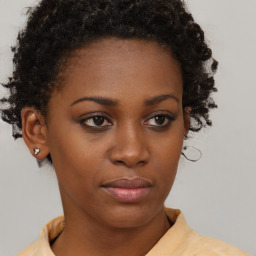 Neutral black young-adult female with short  brown hair and brown eyes